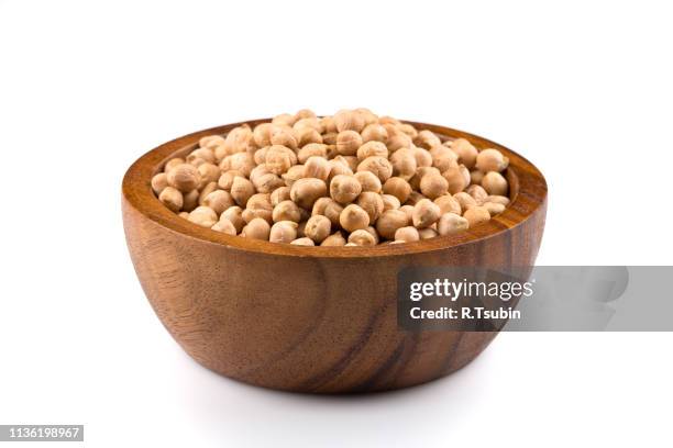 chick-pea in wooden bowl. beans isolated on a white background. close-up. - chick pea stock pictures, royalty-free photos & images