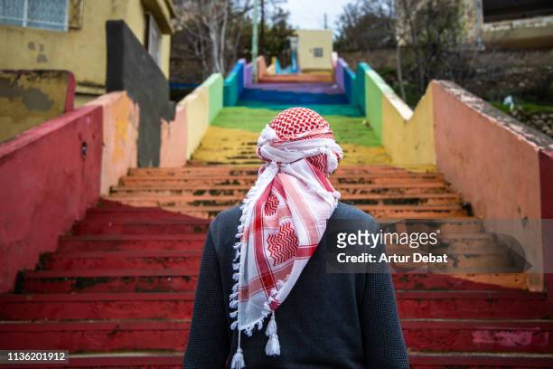 bedouin guy with beautiful colorful stairs in the city of amman. - amman stock pictures, royalty-free photos & images