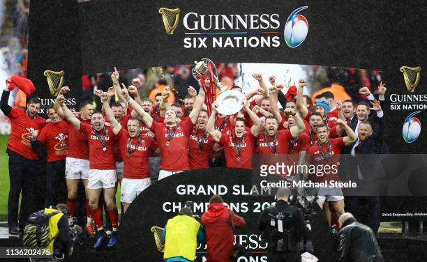Alun Wyn Jones of Wales and Jonathan Davies of Wales lift the Six Nations and Triple Crown Trophy to celebrate winning the Six Nations with there...
