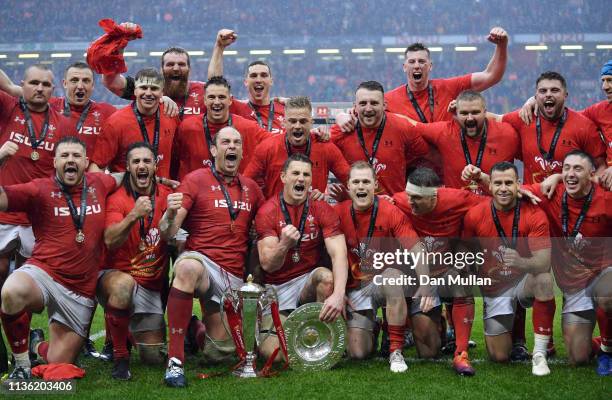 Wales celebrate winning the Triple Crown, Grand Slam and with the Six Nations Trophy following the Guinness Six Nations match between Wales and...