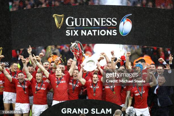 Alun Wyn Jones of Wales and Jonathan Davies of Wales lift the Six Nations and Triple Crown Trophy to celebrate winning the Six Nations with there...