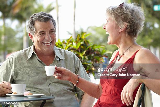 couple sharing a laugh - norman elder stock-fotos und bilder
