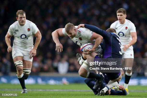 George Kruis of England is tackled by Willem Nel of Scotland during the Guinness Six Nations match between England and Scotland at Twickenham Stadium...