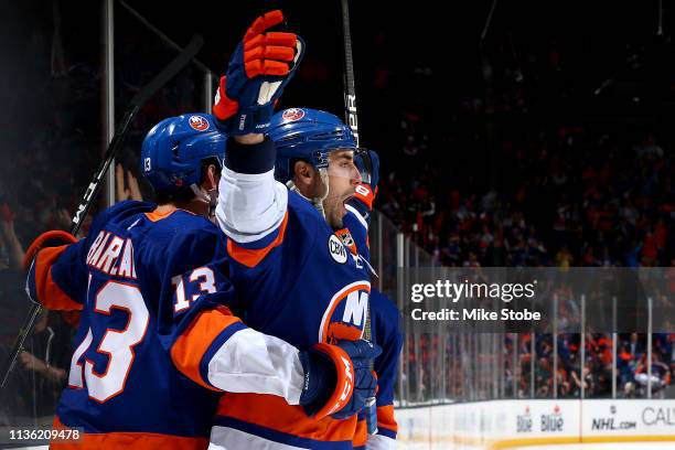 Jordan Eberle of the New York Islanders is congratulated by his teammate Mathew Barzal after scoring a first period goal against the Pittsburgh...