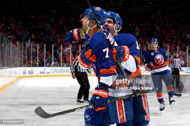 Jordan Eberle of the New York Islanders is congratulated by his teammate Mathew Barzal after scoring a first period goal against the Pittsburgh...