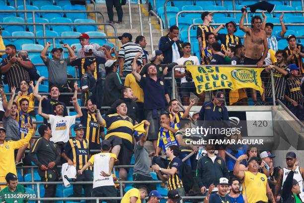 Supporters of Argentina's Rosario Central cheer their team, before the start of the Copa Libertadores 2019 football match against Brazil's Gremio at...