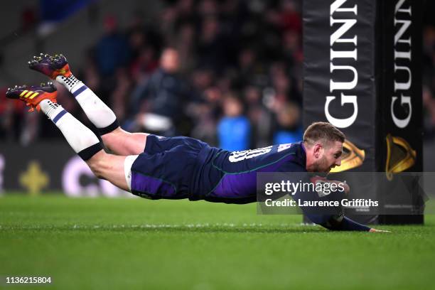 Finn Russell of Scotland scores his team's fifth try during the Guinness Six Nations match between England and Scotland at Twickenham Stadium on...