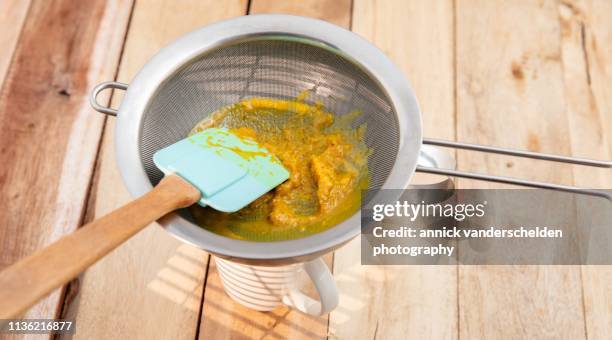 turmeric latte preparation - sieve stock pictures, royalty-free photos & images