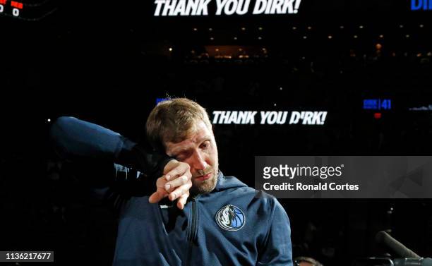 Dirk Nowitzki of the Dallas Mavericks became emotional during video of his highlights before the game against the San Antonio Spurs at AT&T Center on...