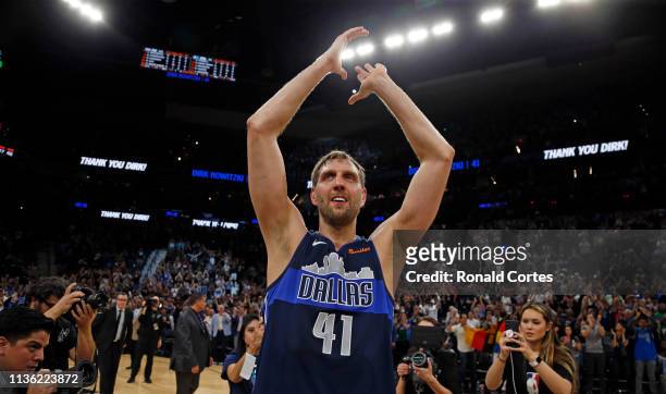 Dirk Nowitzki of the Dallas Mavericks acknowledges fans at the end of his last game against the San Antonio Spurs at AT&T Center on April 10, 2019 in...