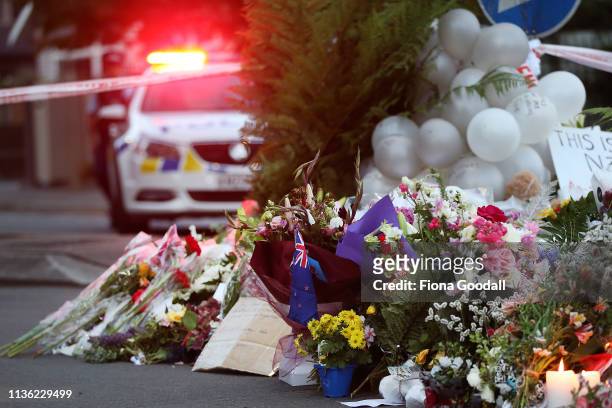 Flower are left at the Al Noor mosque March 17, 2019 in Christchurch, New Zealand. 49 people are confirmed dead, with with 36 injured still in...