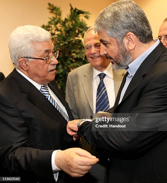 In this handout image provided by PPM, Exiled Leader of Hamas, Khaled Mashaal meets with President of the Palestinian National Authority, Mahmoud...