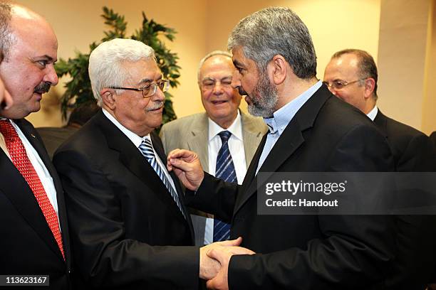 In this handout image provided by PPM, Exiled Leader of Hamas, Khaled Mashaal meets with President of the Palestinian National Authority, Mahmoud...