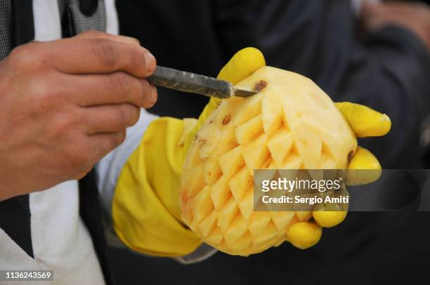 carving a pineapple - pineapple cut stock pictures, royalty-free photos & images