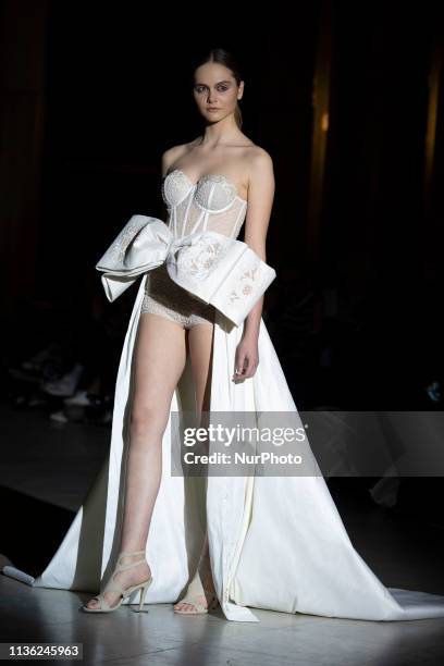 Model with a CABURE Hugo Vazquez design during the MADRID BRIDAL FASHION WEEK show in Madrid, Spain. April 10, 2019