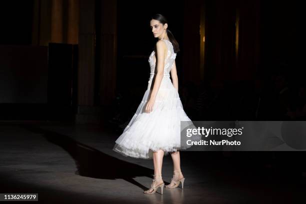 Model with a CABURE Hugo Vazquez design during the MADRID BRIDAL FASHION WEEK show in Madrid, Spain. April 10, 2019