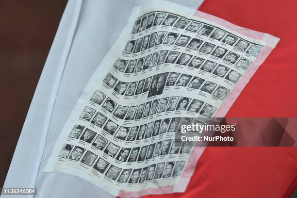 Images of 96 victims of 2010 Smolensk crash, seen attached to a Polish flag, outside of Katyn Cross monument near Wawel Castle, on the day of the 9th...