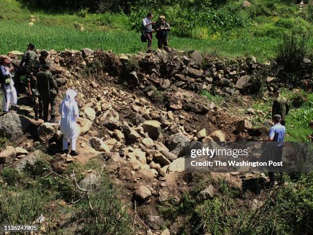 Bomb crater in a meadow in a remote area of Pakistan, left behind after an Indian fighter jet attempted to strike a mountaintop building it said was...