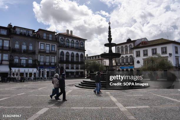 People are seen walking by Republic Square, a landmark in Ponte De Lima. Ponte De Lima is one of the oldest towns of Portugal and known for the...