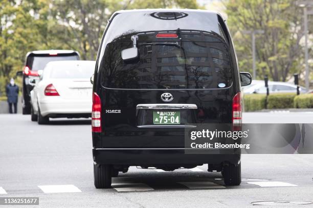 Motorcade believed to be carrying Carole Ghosn, the wife of former Nissan Chief Executive Carlos Ghosn, leaves the Tokyo District Courthouse in...