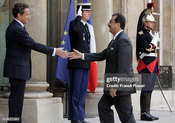 French President Nicolas Sarkozy welcomes Pakistan's Prime Minister Yousuf Raza Gilani at Elysee Palace on May 4, 2011 in Paris, France. After the...