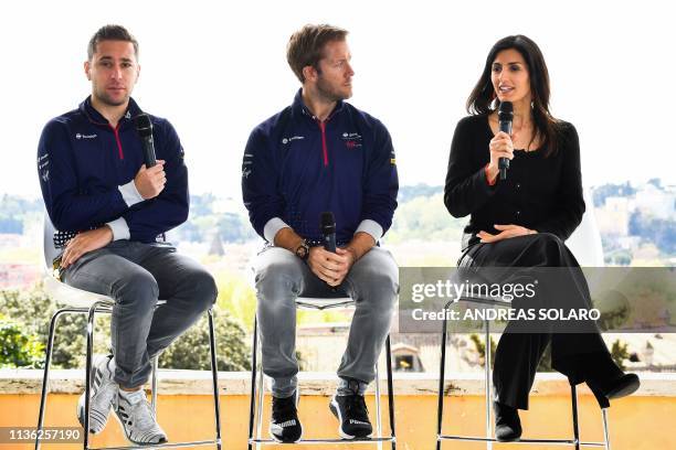 Rome mayor Virginia Raggi speaks as Envision Virgin Racing Formula E drivers, Britain's Sam Bird and Dutch Robin Frijns look on during a press...