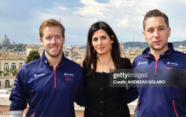 Rome mayor Virginia Raggi poses with Envision Virgin Racing Formula E drivers, Britain's Sam Bird and Dutch Robin Frijns within a press conference on...