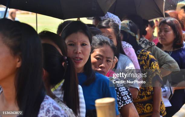 Voters stand in queue to cast their vote on the first phase of India Lok Shaba Election in Dimapur, India north eastern state of Nagaland on...