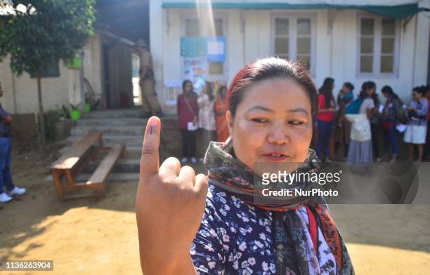 Voter show her ink mark on her finger after casting her vote on the first phase of India Lok Shaba Election in Dimapur, India north eastern state of...