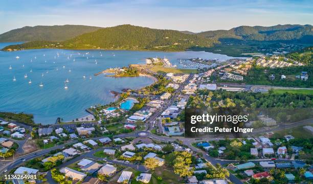 aerial view of the township of airlie beach,queensland,australia - queensland aerial stock pictures, royalty-free photos & images