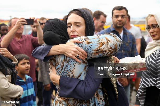 Prime Minister Jacinda Ardern hugs a mosque-goer at the Kilbirnie Mosque on March 17, 2019 in Wellington, New Zealand. 50 people are confirmed dead...