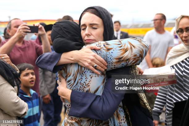 Prime Minister Jacinda Ardern hugs a mosque-goer at the Kilbirnie Mosque on March 17, 2019 in Wellington, New Zealand. 50 people are confirmed dead...