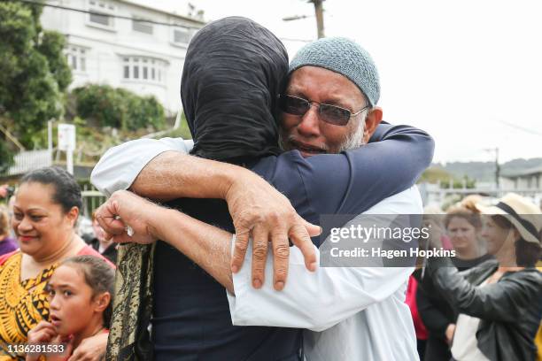 Prime Minister Jacinda Ardern hugs a mosque-goer at the Kilbirnie Mosque on March 17, 2019 in Wellington, New Zealand. 50 people are confirmed dead...