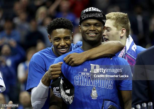 Teammates RJ Barrett and Zion Williamson of the Duke Blue Devils react after defeating the Florida State Seminoles 73-63 in the championship game of...