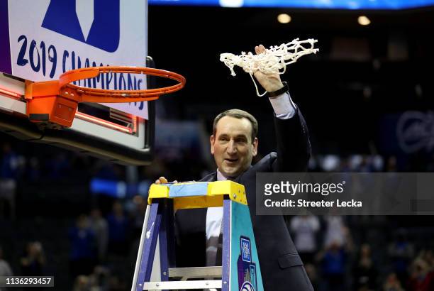 Head coach Mike Krzyzewski of the Duke Blue Devils cuts down the net after defeating the Florida State Seminoles 73-63 in the championship game of...