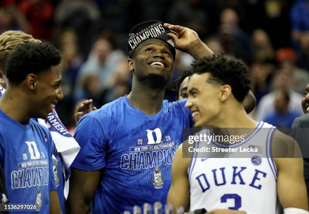 Teammates Zion Williamson, RJ Barrett, and Tre Jones of the Duke Blue Devils react after defeating the Florida State Seminoles 73-63 in the...