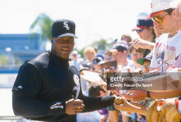 First baseman Frank Thomas of the Chicago White Sox signs autographs for fans prior to the start of an Major League Baseball spring training game...