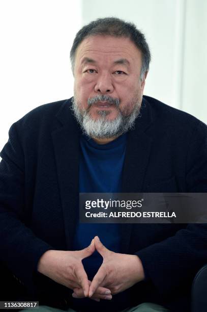 Chinese contemporary artist and activist Ai Weiwei listens to a question during a press conference on his new exhibition at the University Museum of...