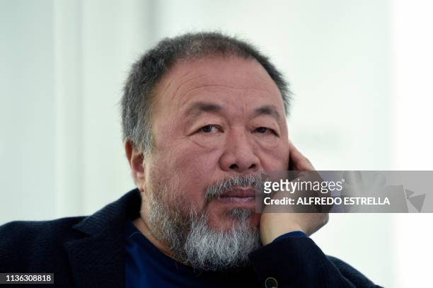 Chinese contemporary artist and activist Ai Weiwei listens to a question during a press conference on his new exhibition at the University Museum of...