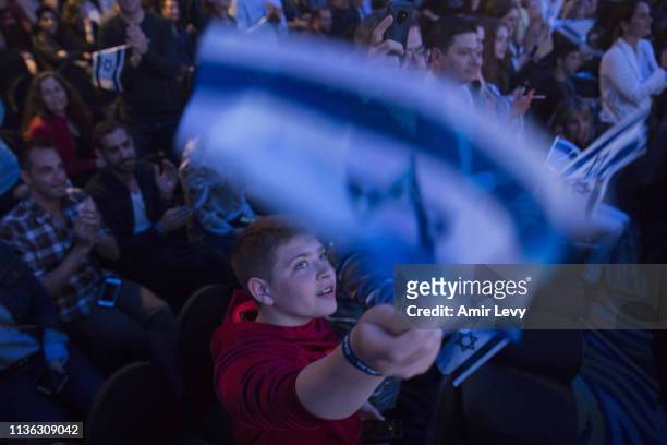 An Israeli boy waves the Israeli flag after Beresheet spacecraft fails to land safely on the moon on April 11, 2019 in Tel Aviv, Israel. The Israeli...