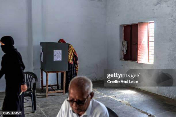 An Indian Muslim woman votes at a polling station on April 11, 2019 in Muzzafarnagar, Utter Pradesh, India. Indians voted in the first phase of...