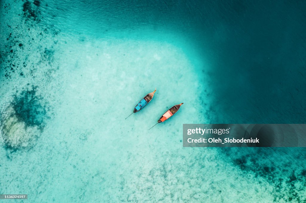 Scenic aerial view of two boats on sea in Thailand