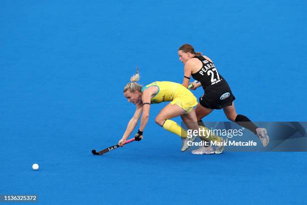 Jane Claxton of Australia and Holly Pearson of New Zealand compete for the ball during the FIH Field Hockey Pro League Womens match between Australia...