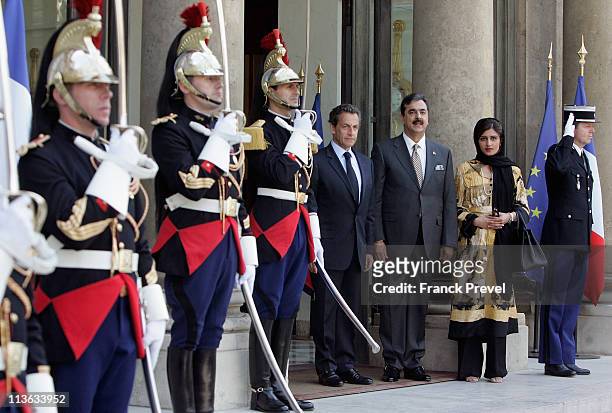 French President Nicolas Sarkozy welcomes Pakistan's Prime Minister Yousuf Raza Gilani and Pakistani State Minister for Finance, Revenue and Economic...