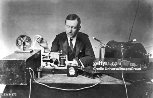 Guglielmo Marconi , Italian physicist and inventor. Radio pioneer. Marconi with typical apparatus, including 10-inch induction coil spark transmitter...