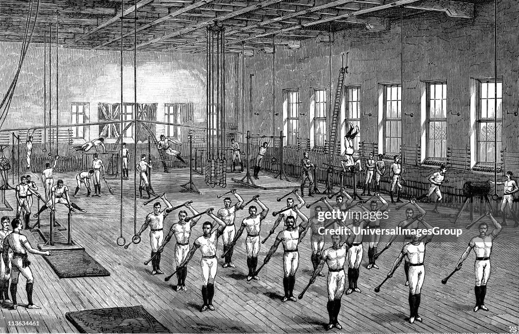 Young Men's Christian Association (YMCA) gymnasium, Longacre, London, opened by the Prince of Wales, 16 June 1888. Men exercising using various apparatus. Wood engraving.