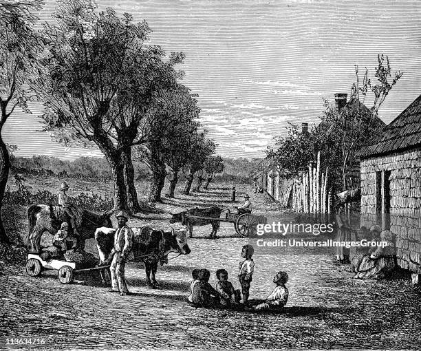 Slave quarters on a plantation in Georgia, USA. Wood engraving c1860