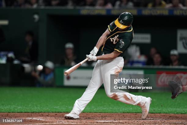 Infielder Matt Olson of the Oakland Athletics hits a single in the top of 3rd innig during the game between Hokkaido Nippon-Ham Fighters and Oakland...