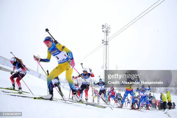 General view as competitors make their way up a hill in the Women's Mass Start at the IBU Biathlon World Championships on March 17, 2019 in...