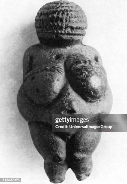 Venus of Willendorf: Stone age oolitic limestone carving.
